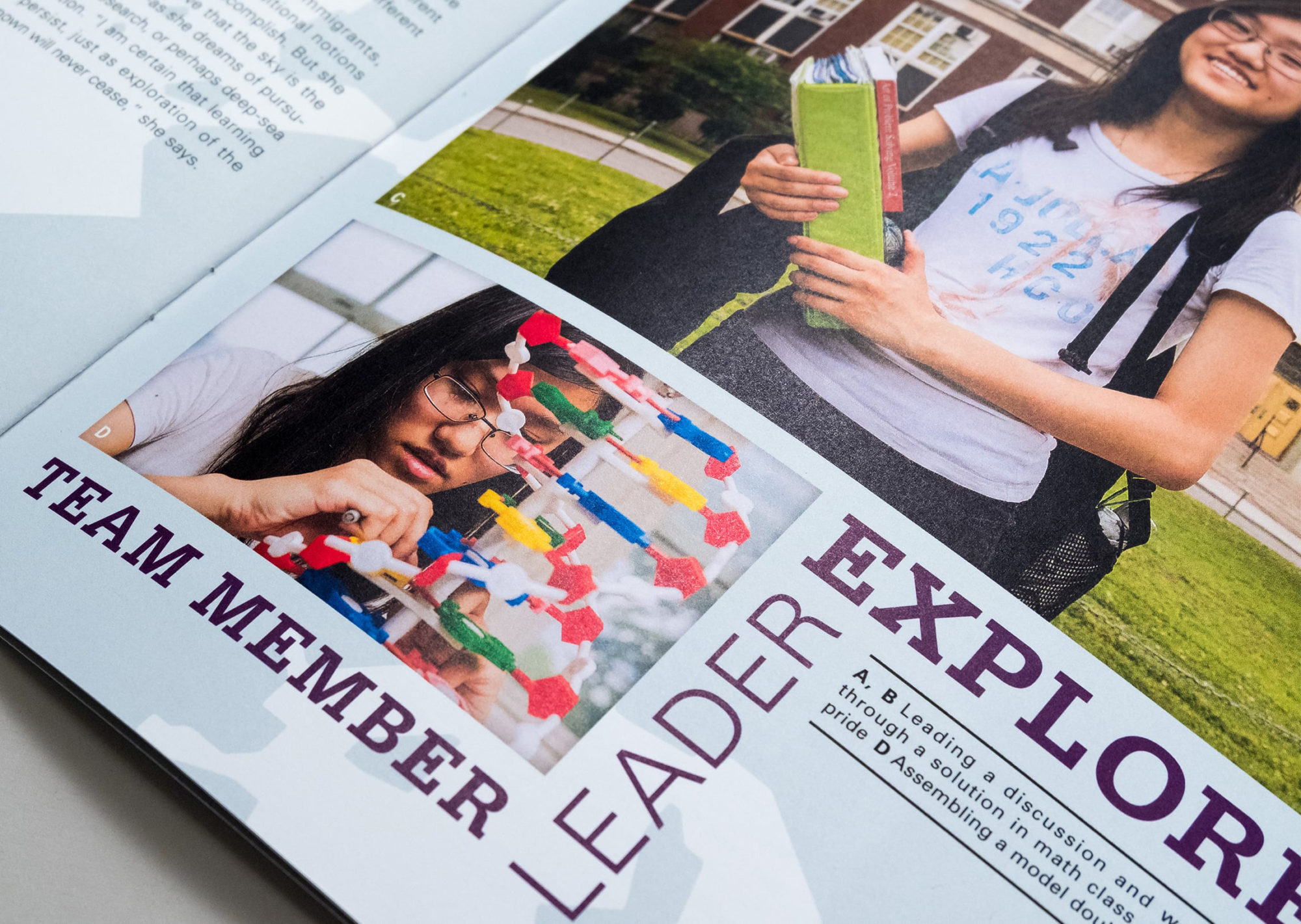 Detail of student profile page for Emily Lin showing a photograph of her building a model of DNA with the words "Team Member, Leader, Explorer" surrounding it