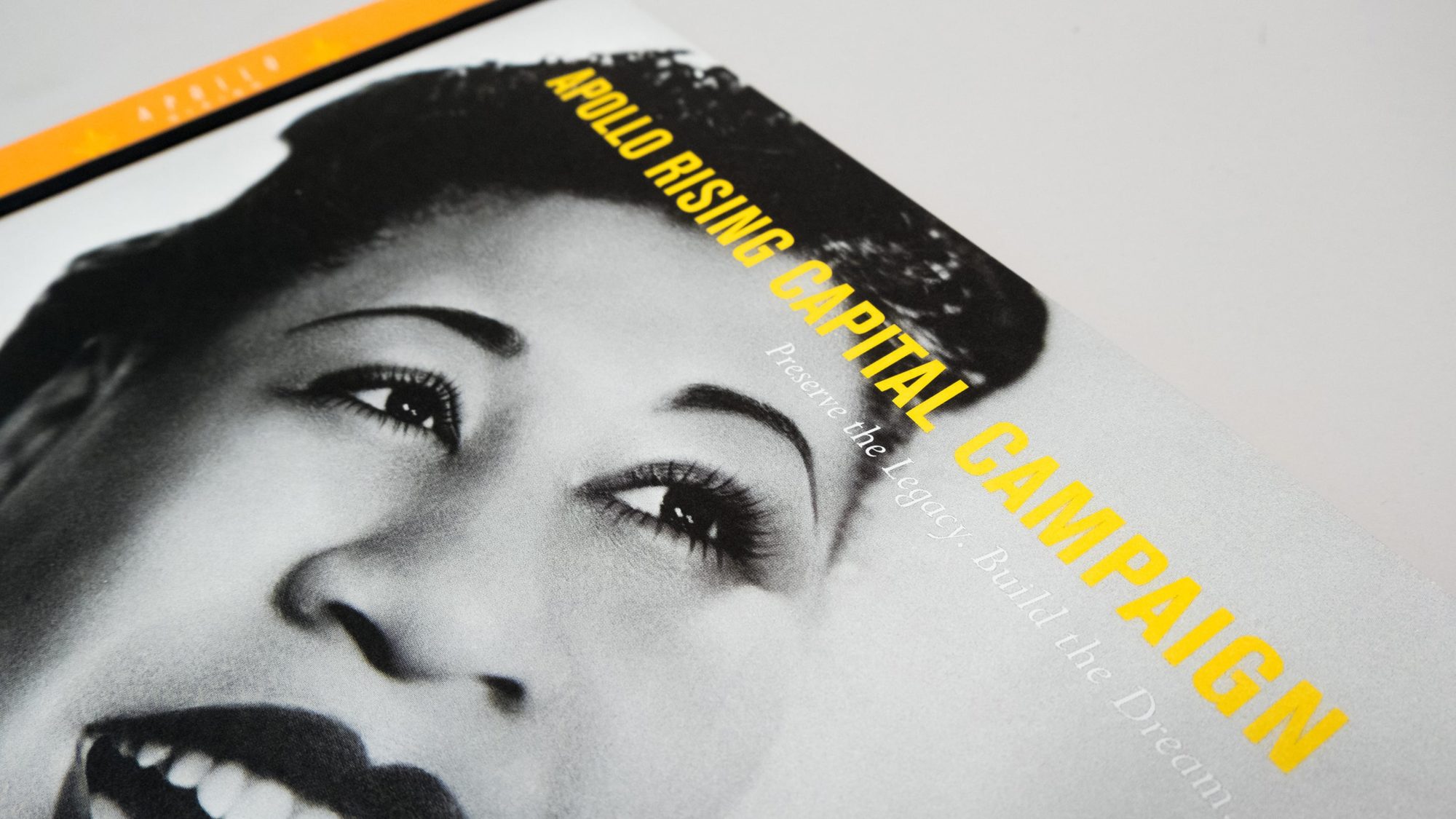 Cover design of caste statement with Apollo Rising title and black and white photo of Billie Holiday