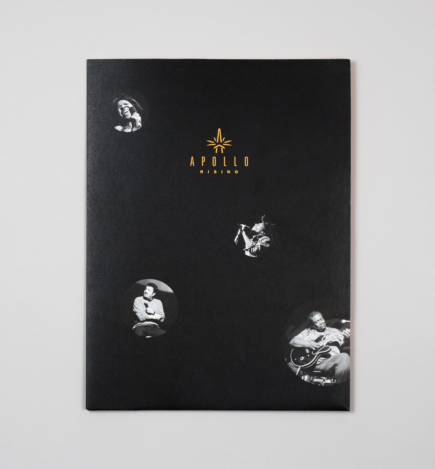 Front of the fundraising campaign's folder with Apollo Rising campaign branding and black and white archival photos