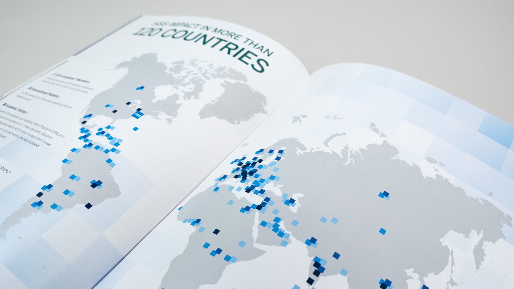 Illustrated map of the world showing the hospital's reach, impact, and influence, with squares plotted in over 120 countries